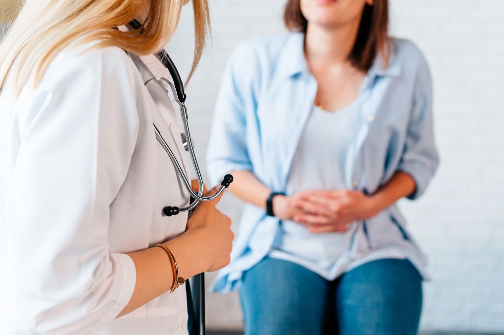 Sick woman visiting a doctor