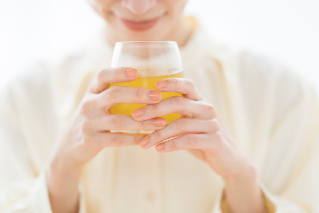Woman drinking apple cider vinegar