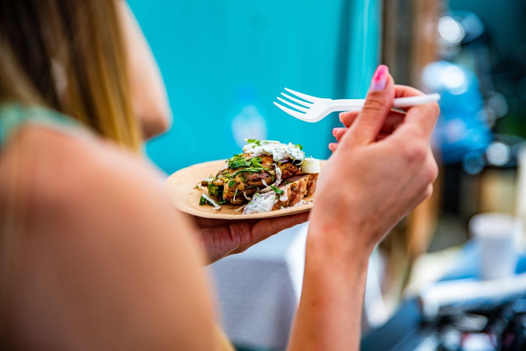 Woman eating meat and veggies 