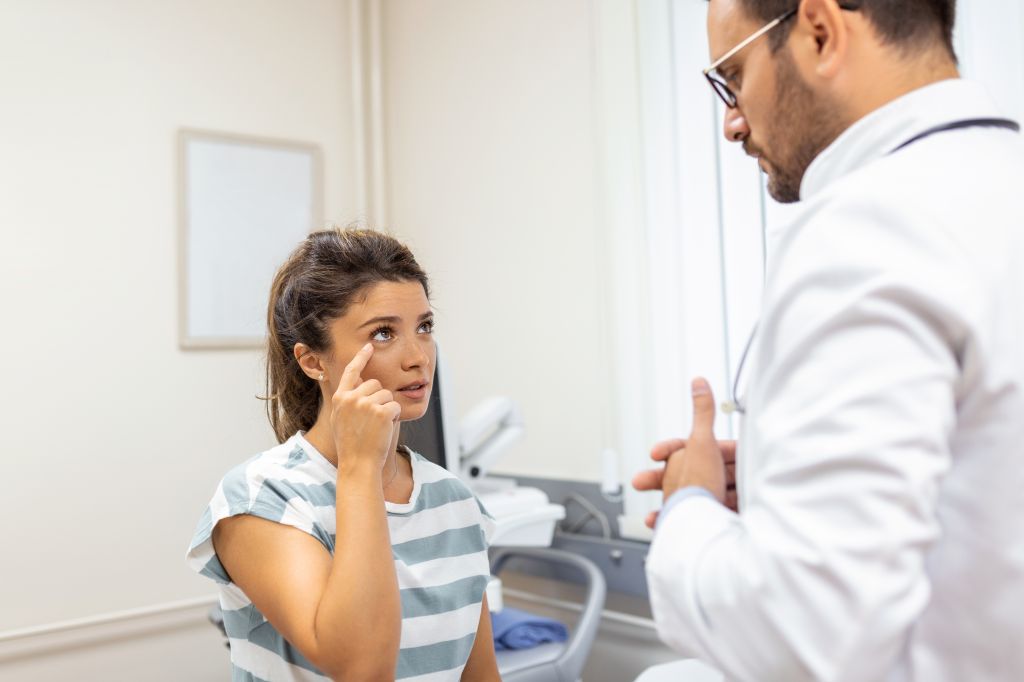 Patient explaining eye pain