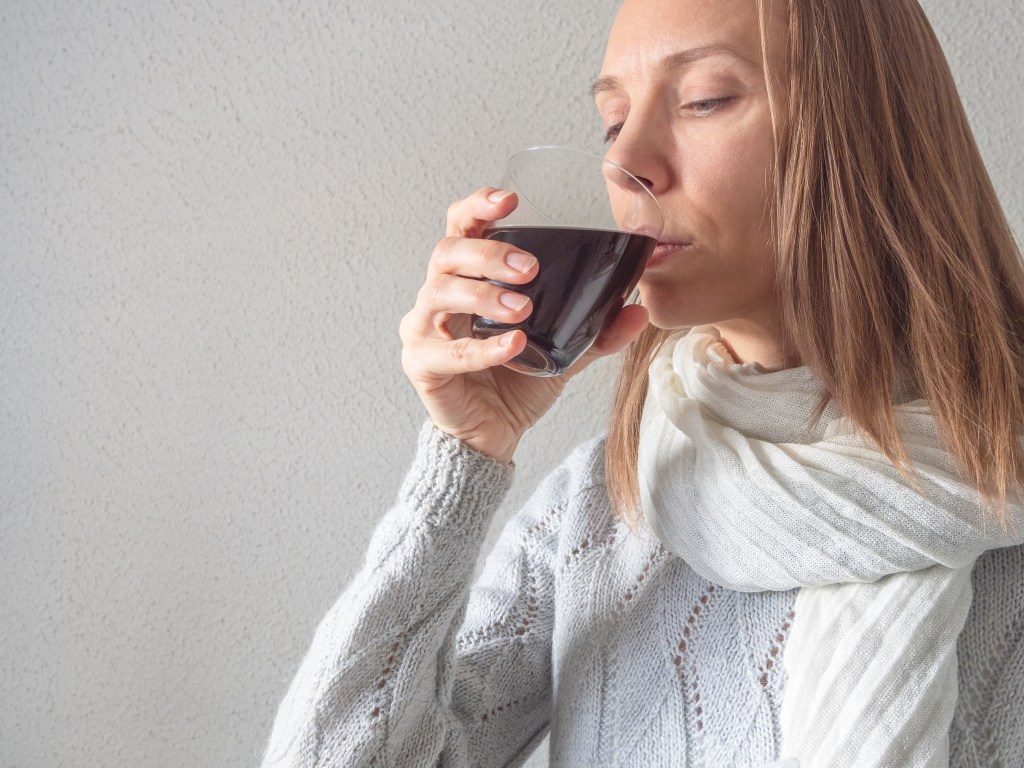 Woman drinking a fulvic acid supplement