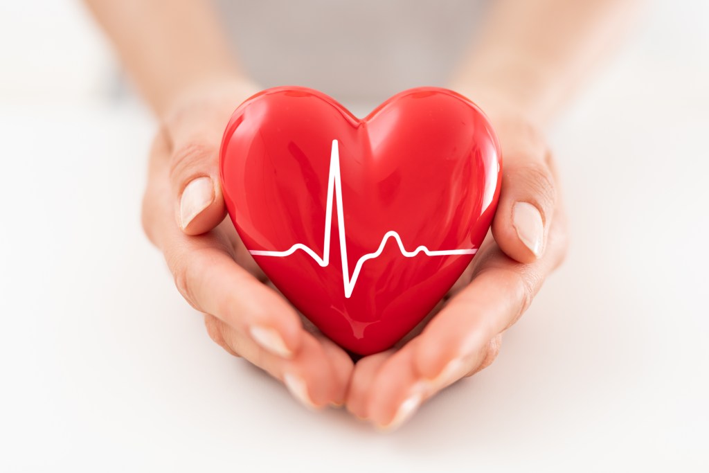Woman holding red heart