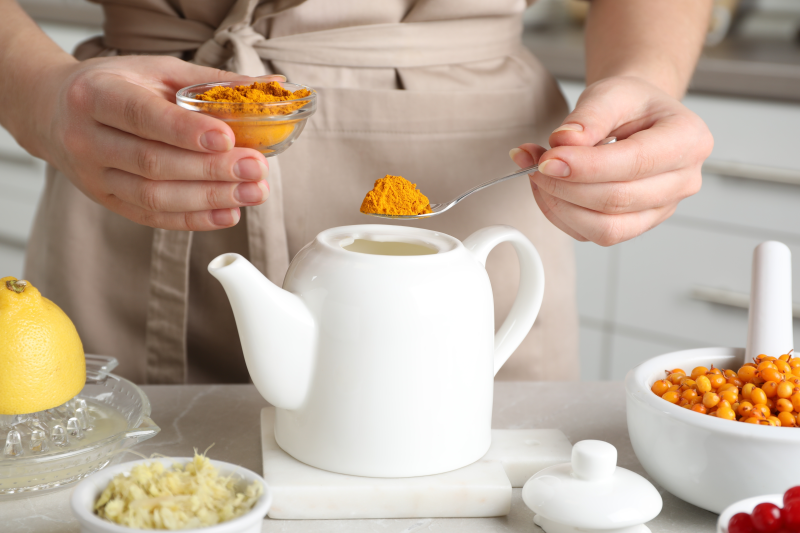 Woman making turmeric tea