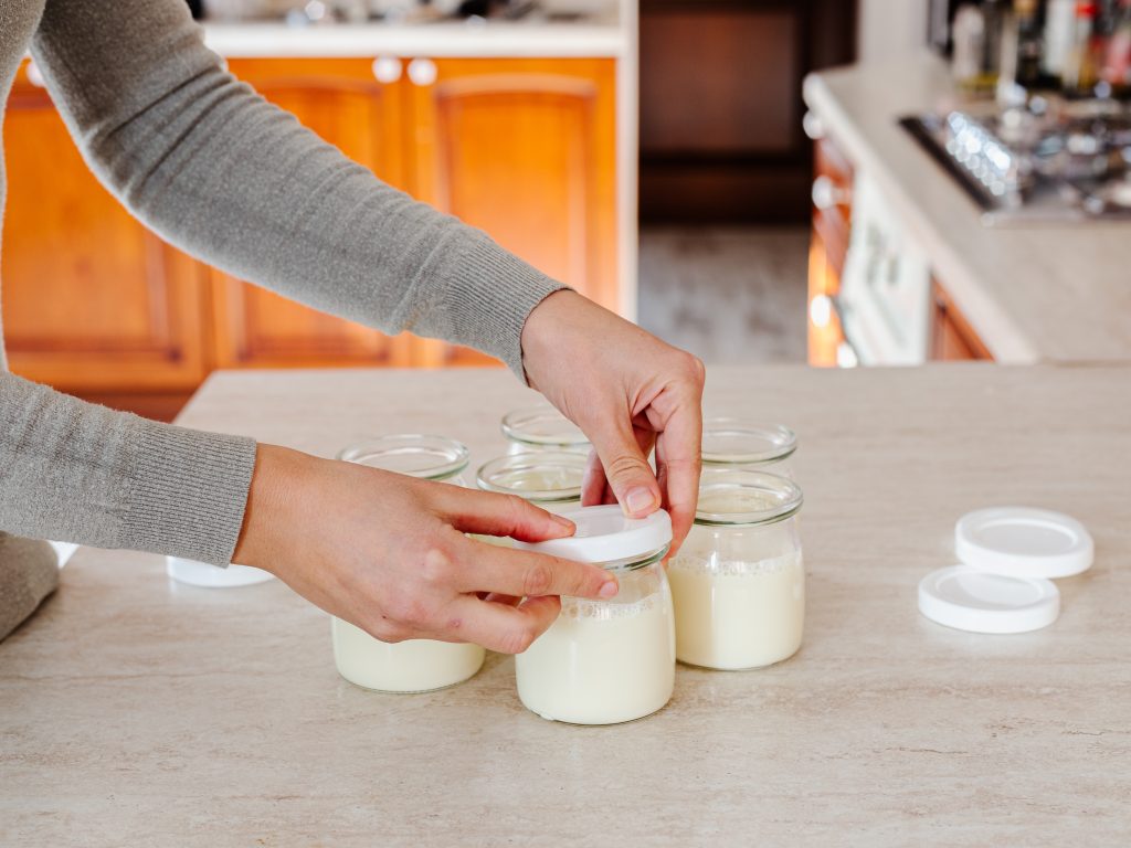 Woman making yogurt