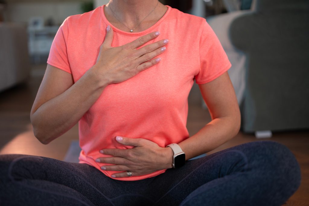 Women practicing deep breathing