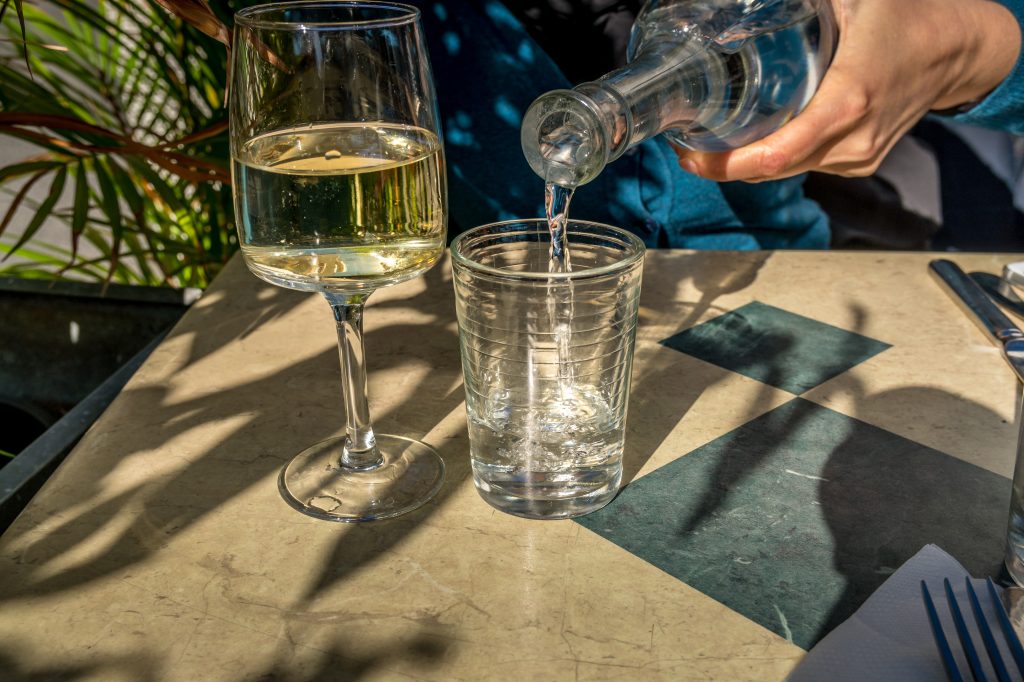 Glass of wine next to a glass of water  