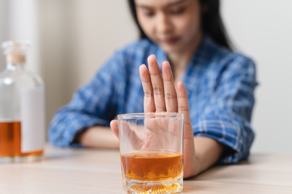 Woman saying no to alcohol 