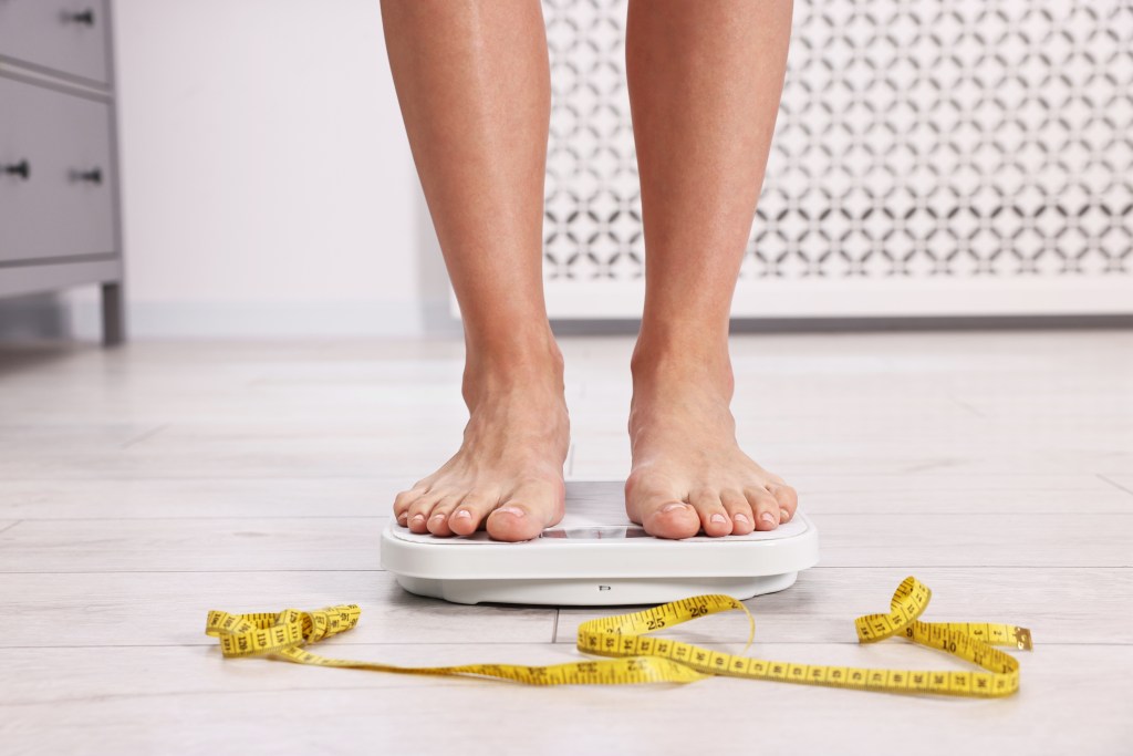 Woman standing on scale