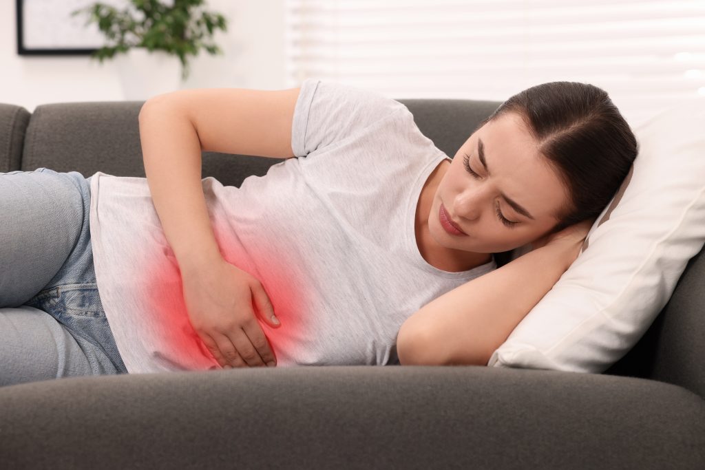 Woman suffering from abdominal pain