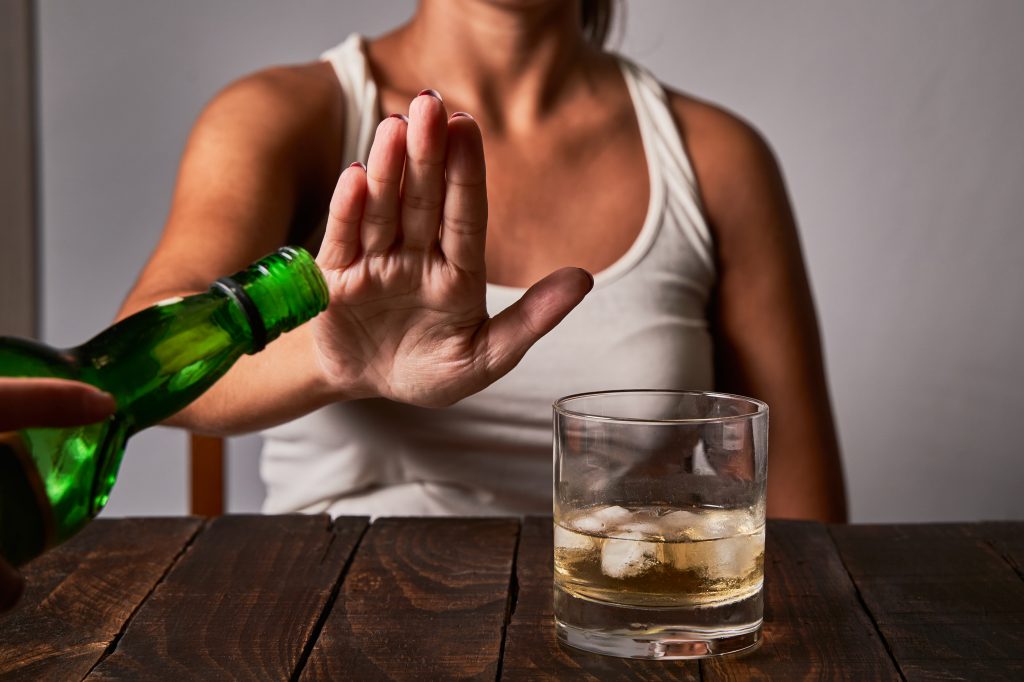 Woman declining a refill 