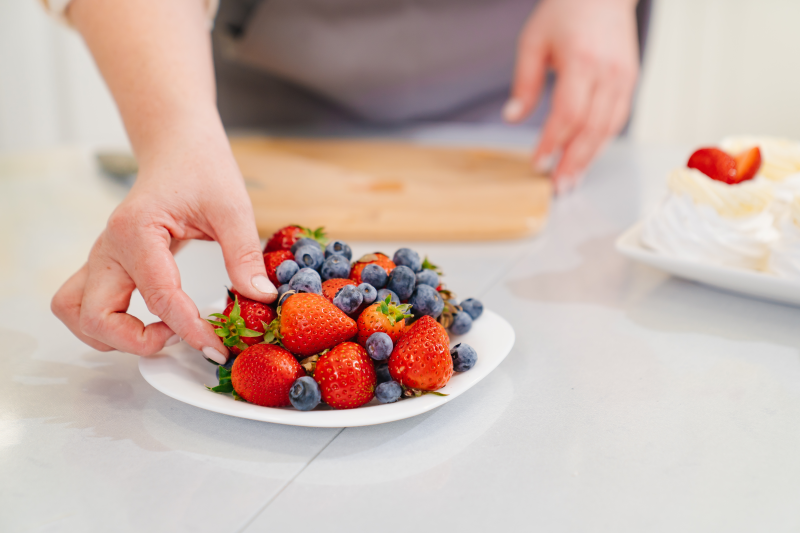 Woman eating strawberries