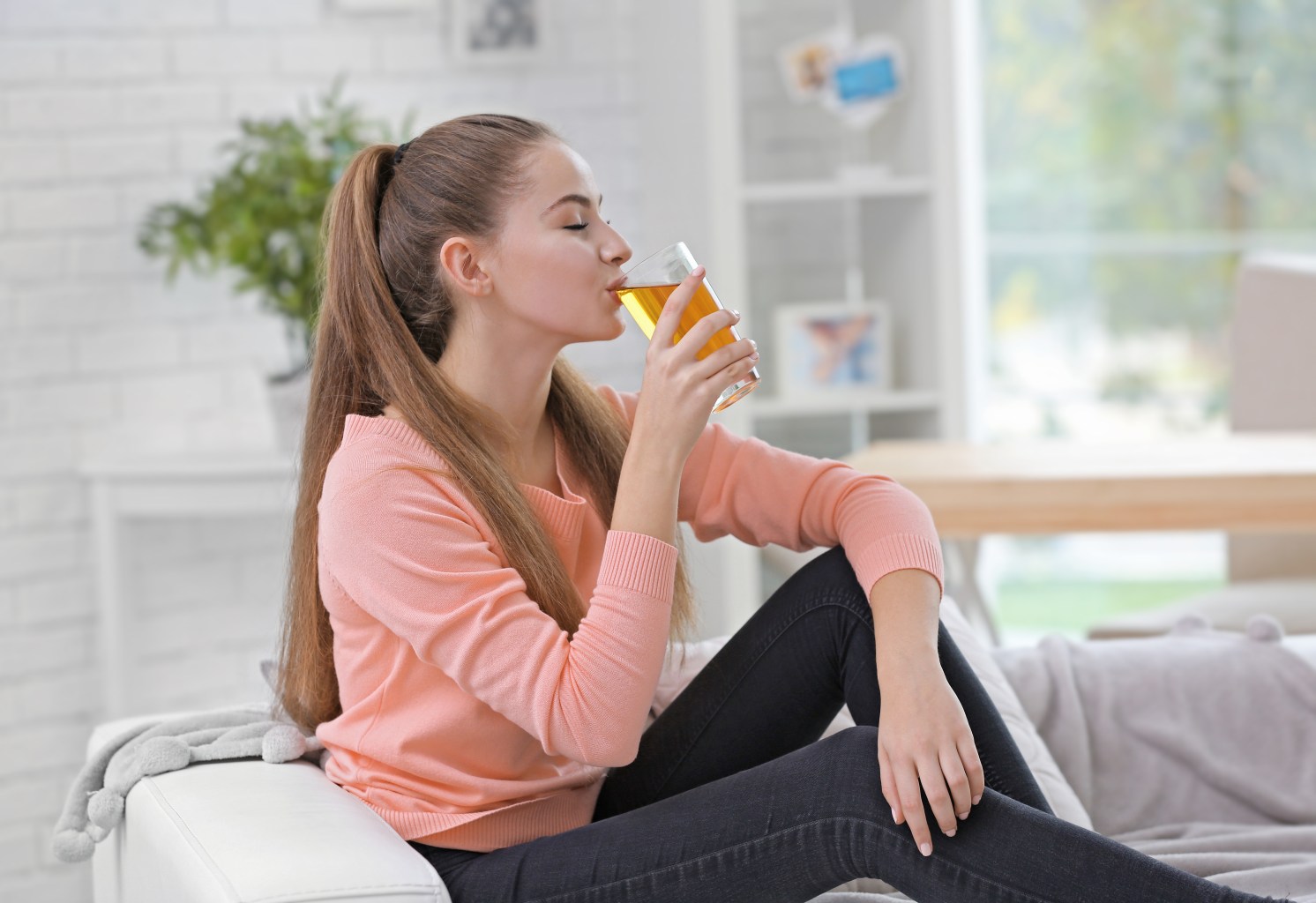 Woman drinking apple cider mix 