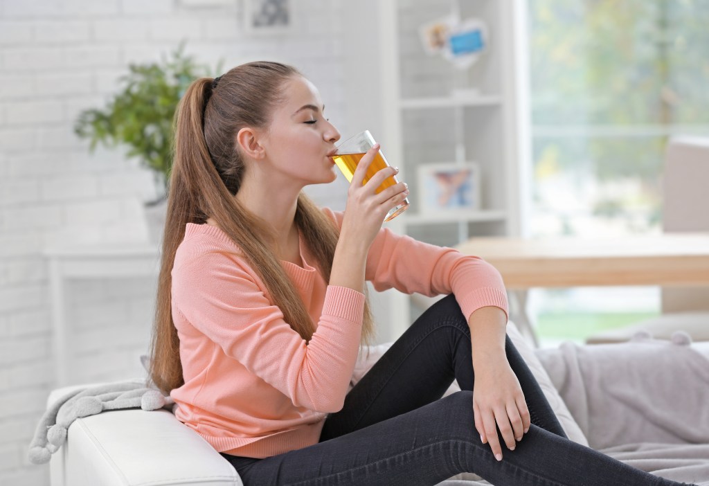Woman drinking apple cider mix