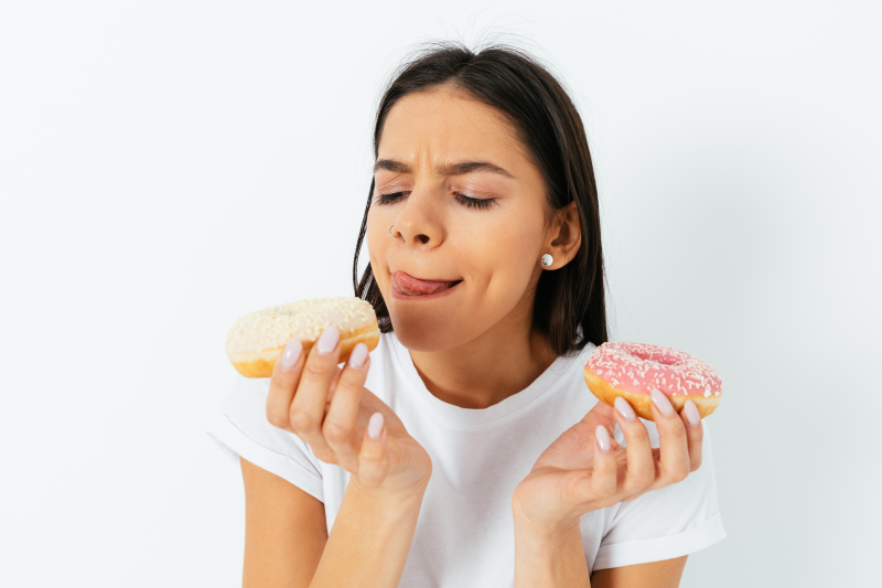 Woman holding donuts