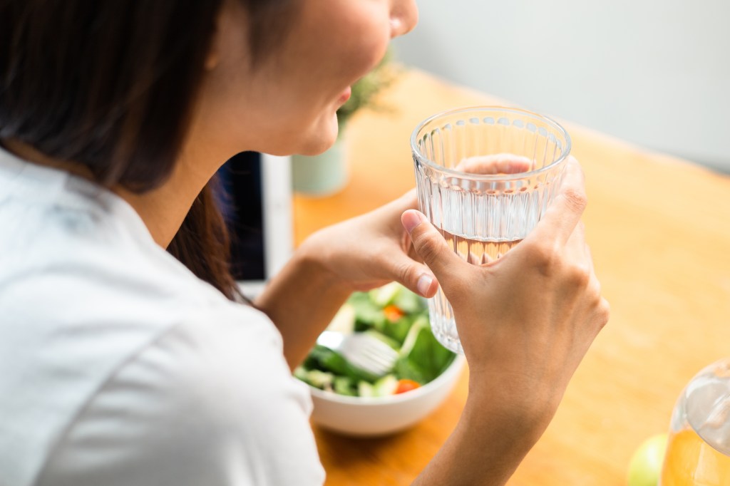 Woman drinking before a meal
