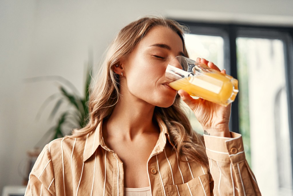 Woman drinking ACV
