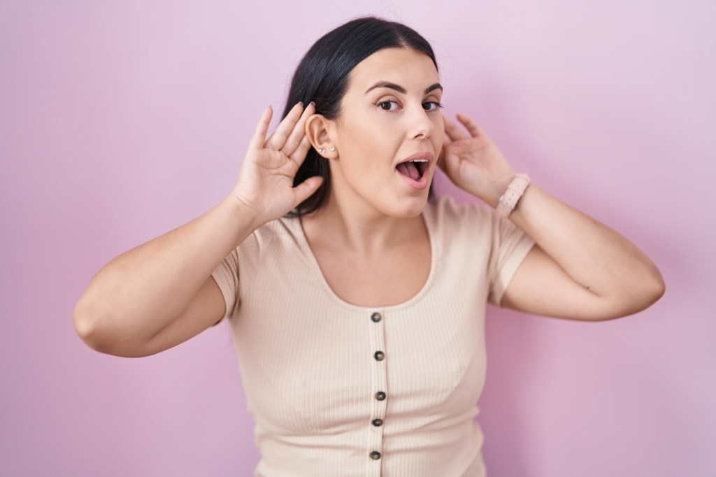 Woman yawning to help regulate pressure in ear tubes&nbsp;