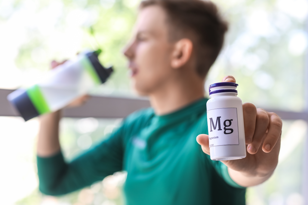 Man taking magnesium supplement
