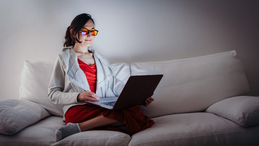 Woman wearing blue light blocking glasses