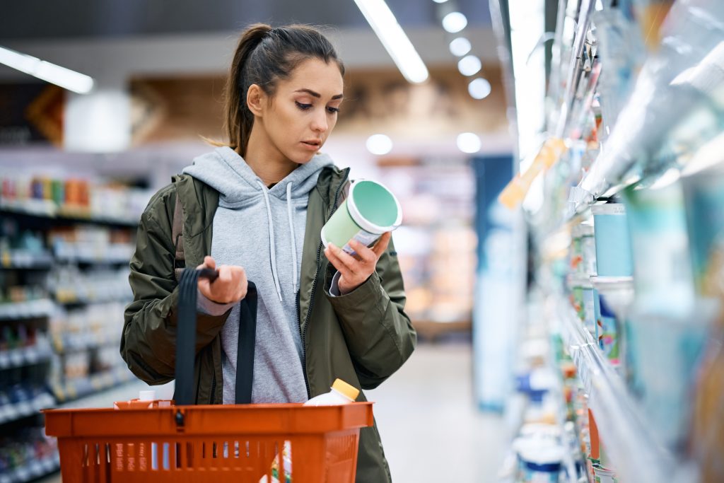 Women reading a dairy food label