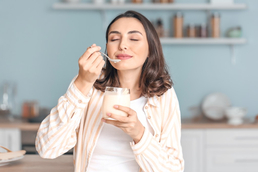 Woman eating yogurt