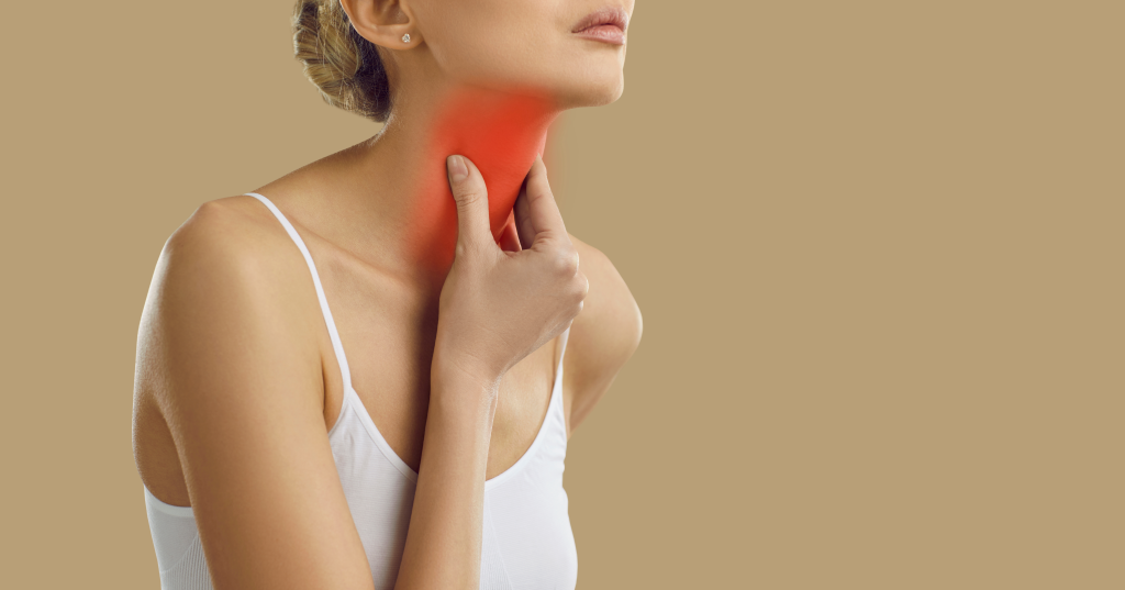 Woman with throat pain
