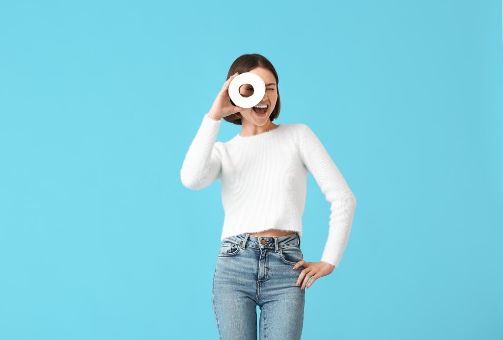 Woman holding toilet paper
