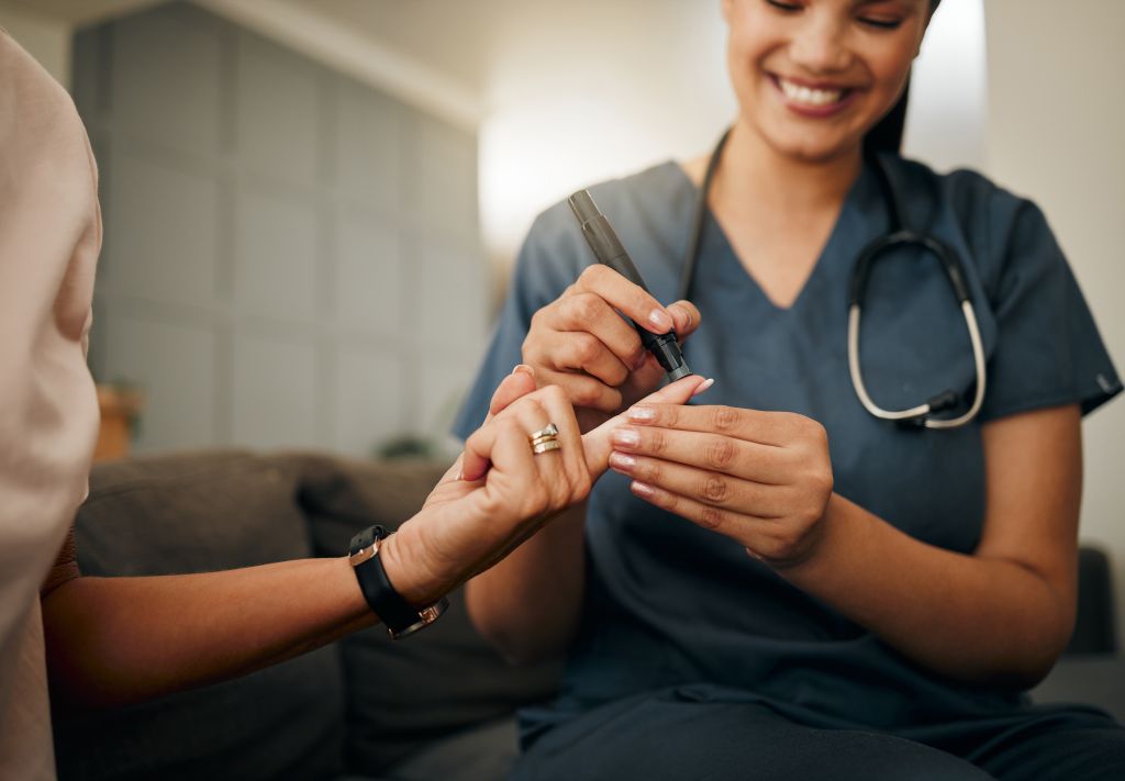 Doctor testing blood sugar levels