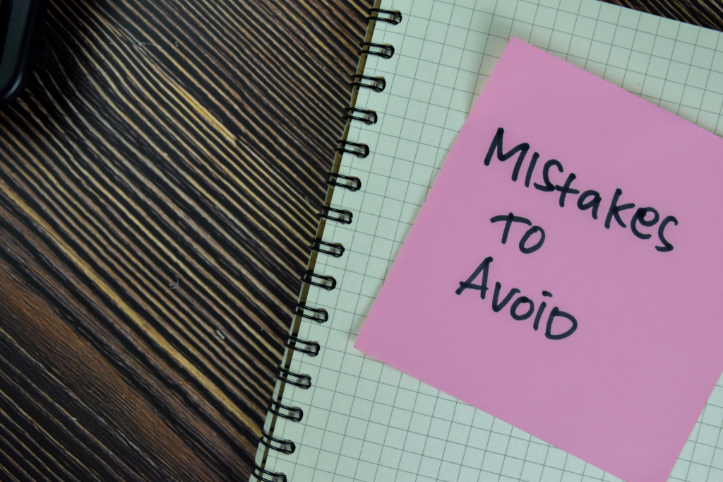 Mistakes to avoid written on a Post-it note