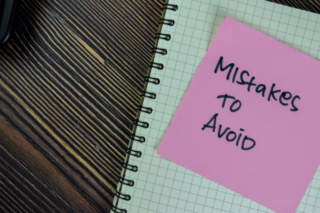 Mistakes to avoid written on a Post-it note