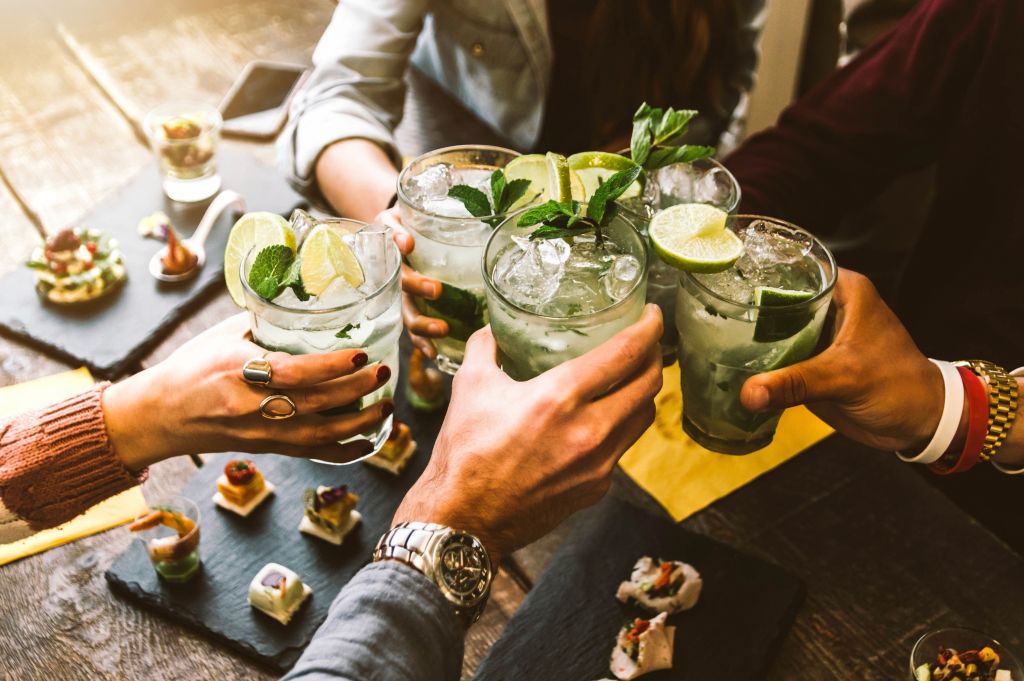 a group of people holding drinks