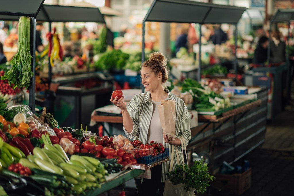Woman buying vegetables