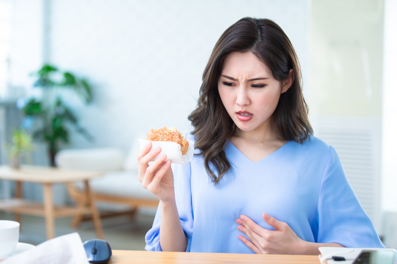 Woman with reflux symptoms 