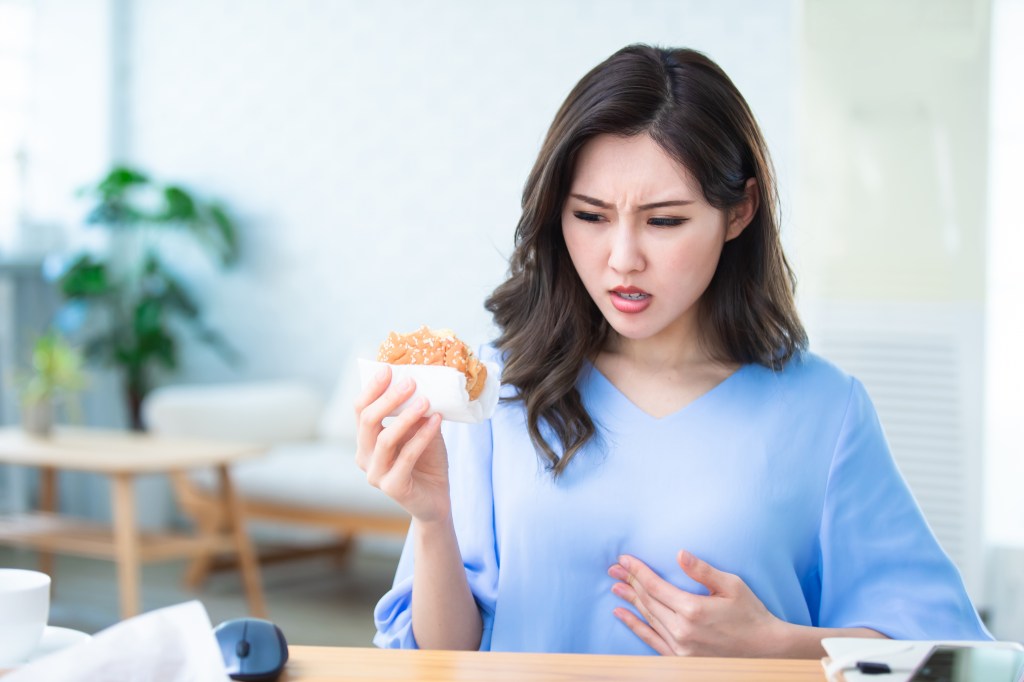 Woman with reflux symptoms