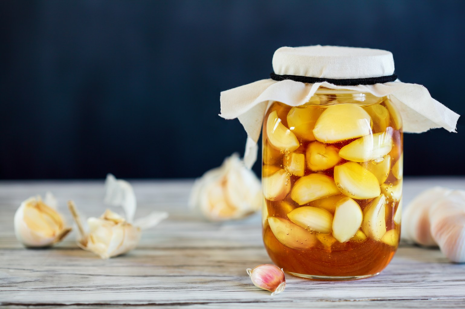 Jar of honey fermented garlic