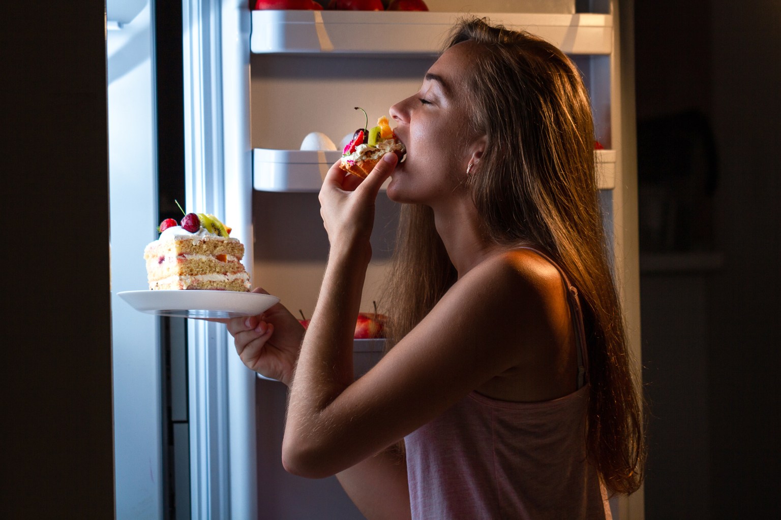  Woman eating nighttime snack