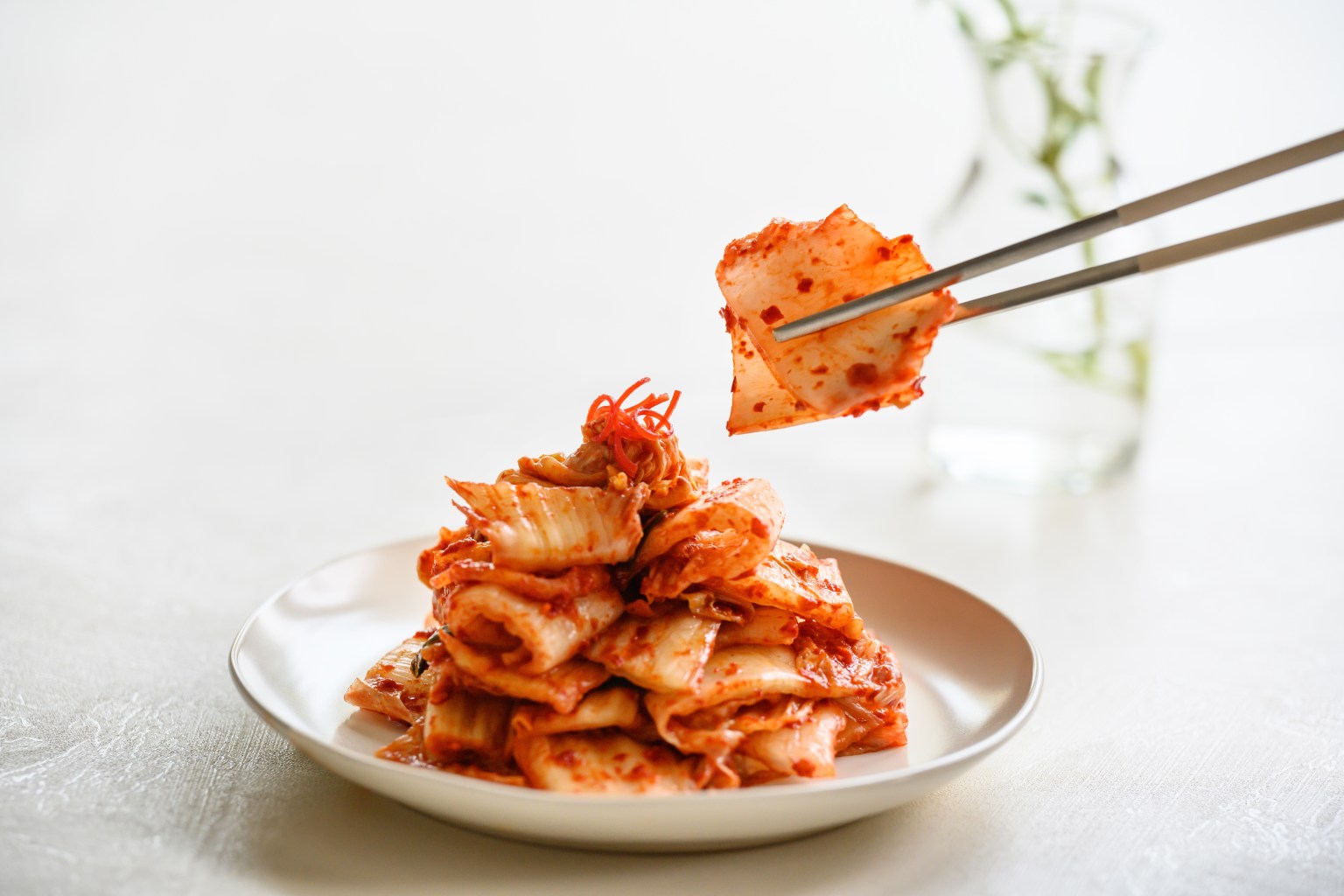 Eating kimchi with chopsticks