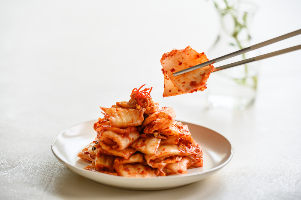 Eating kimchi with chopsticks