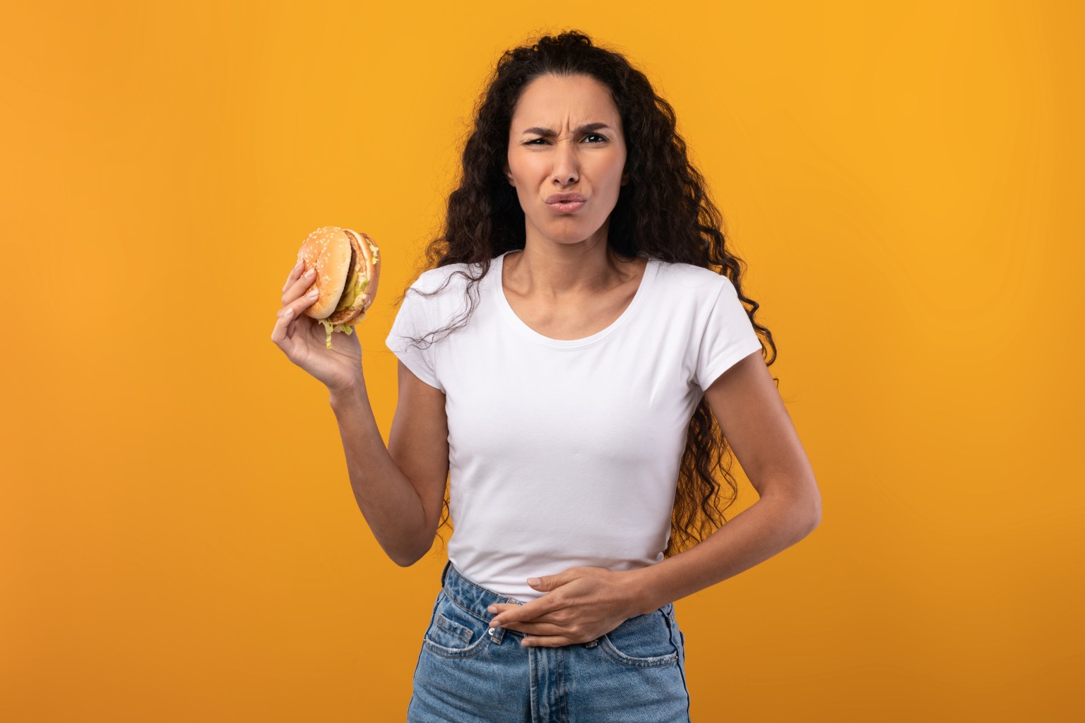 Woman eating junk food   