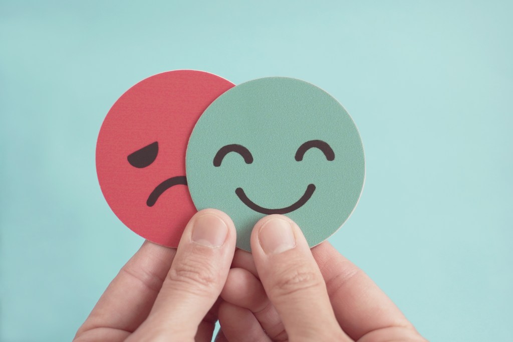Happy face and sad face cutouts
