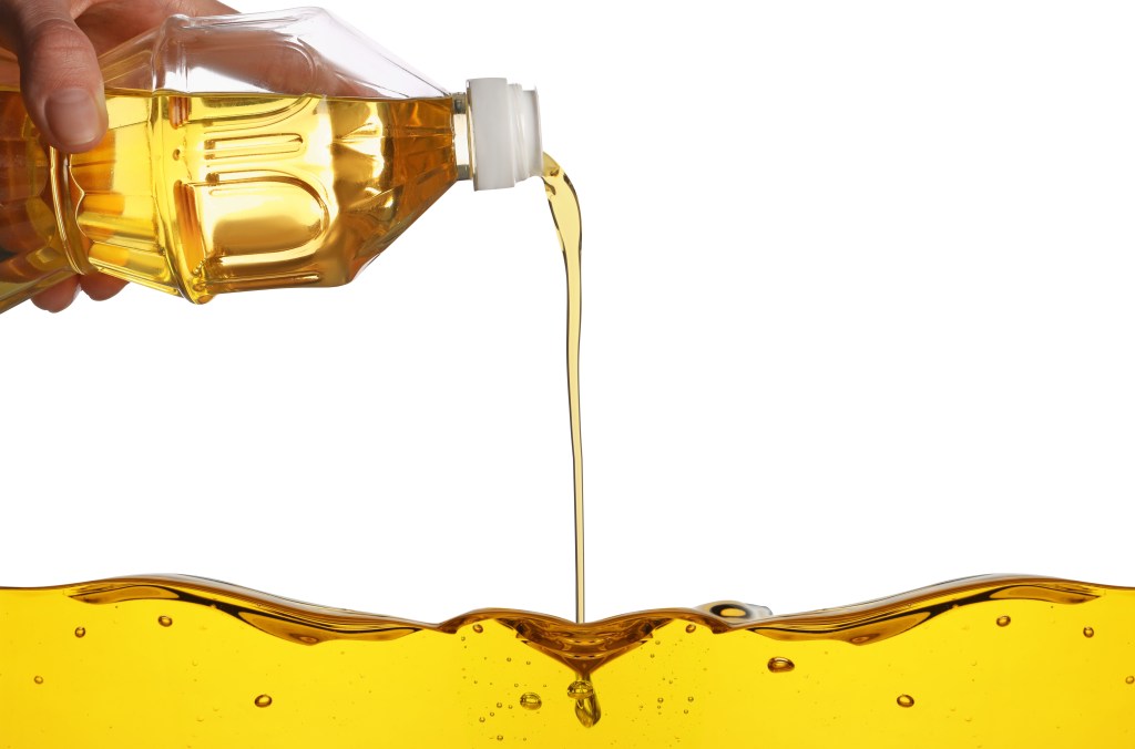 Pouring canola oil