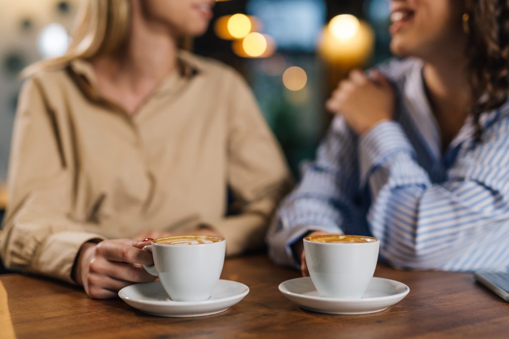 Two women drinking coffee 
