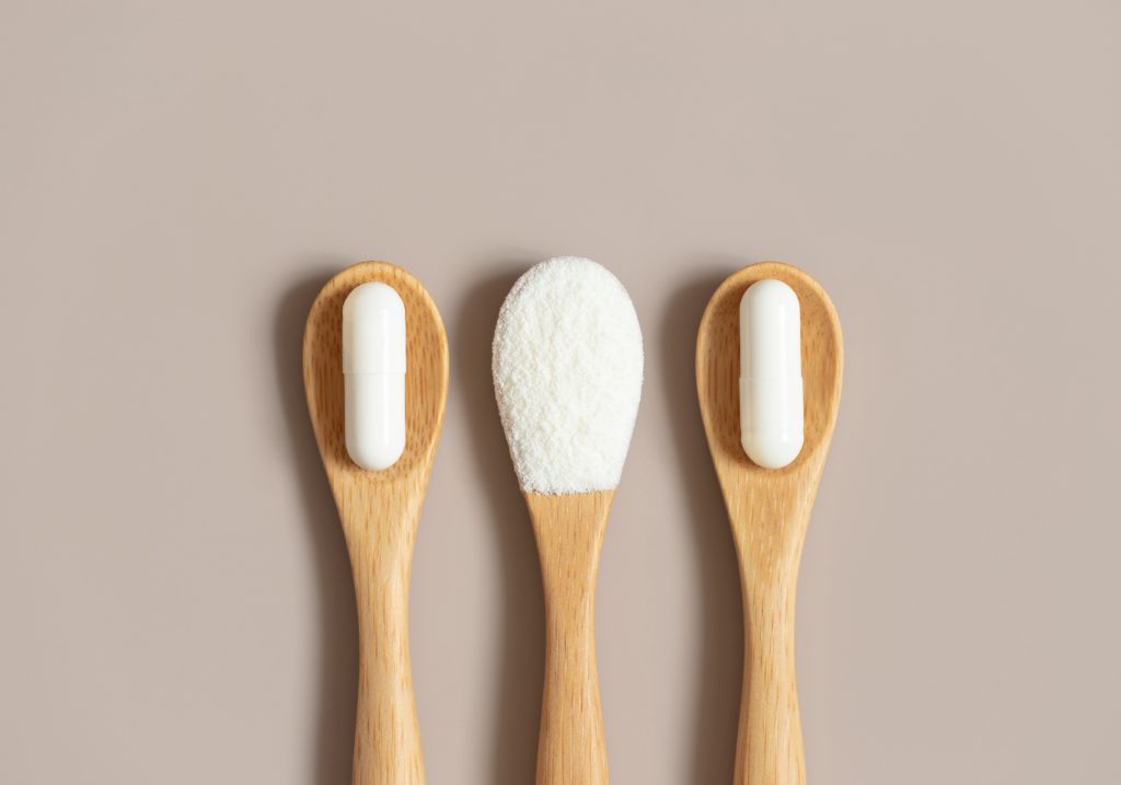 Powder and supplements on a spoon   