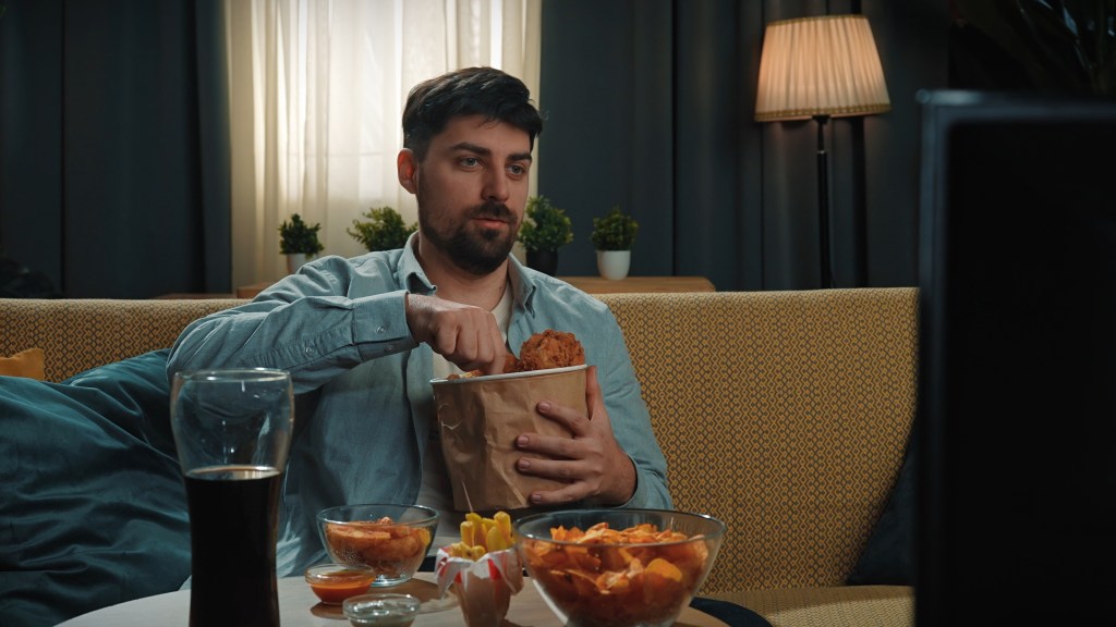 Man eating junk food