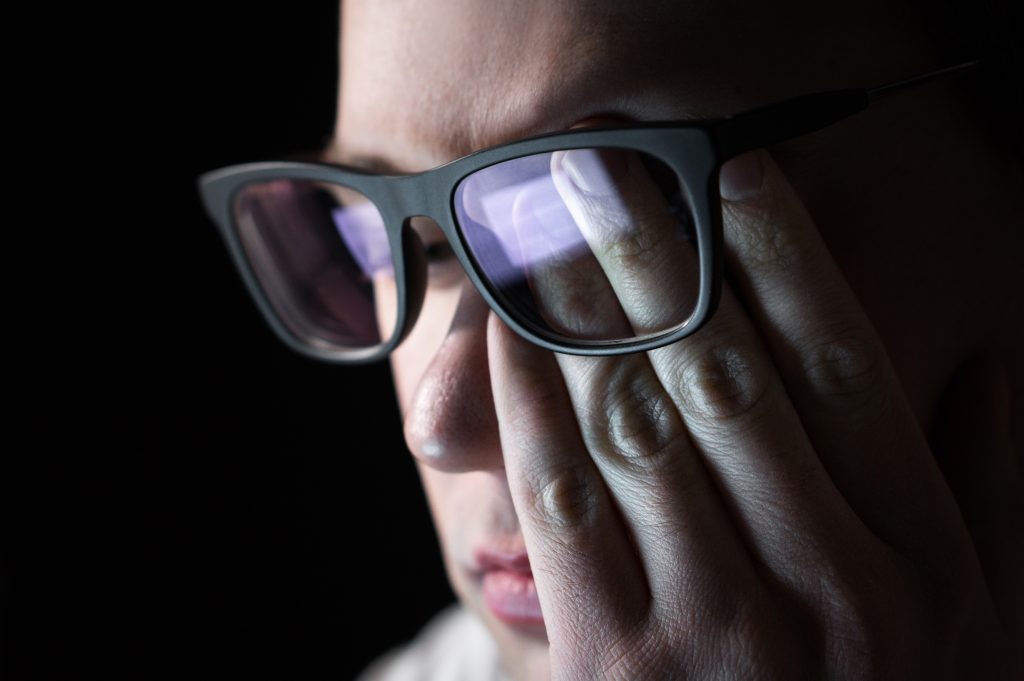 Man rubbing eyes