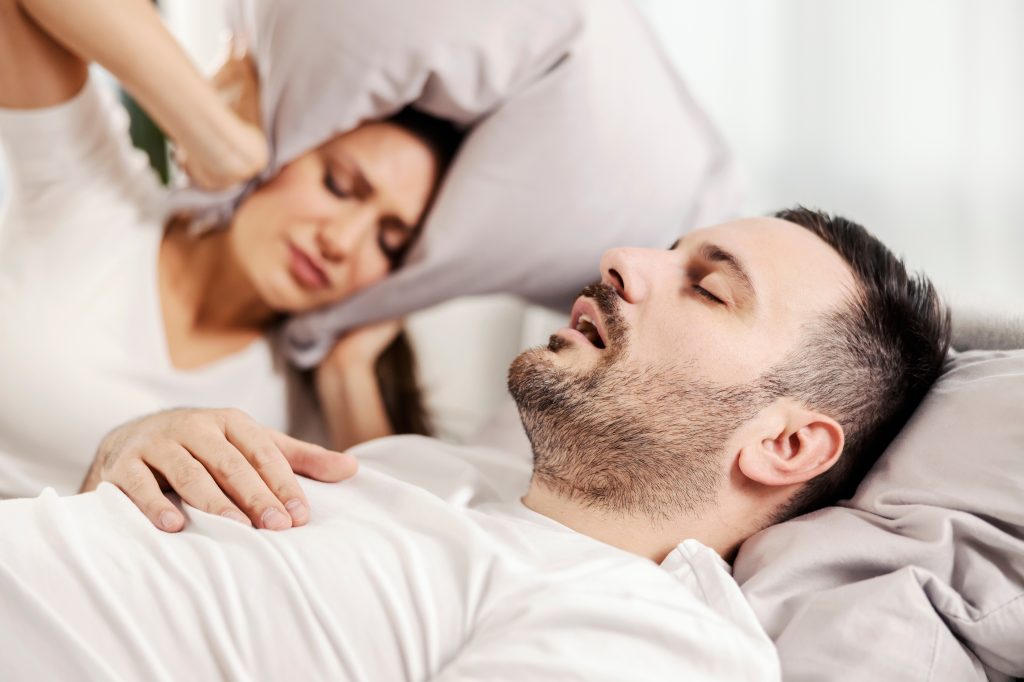 Man with sleep apnea illustrating why am I still tired after 8 hours of sleep