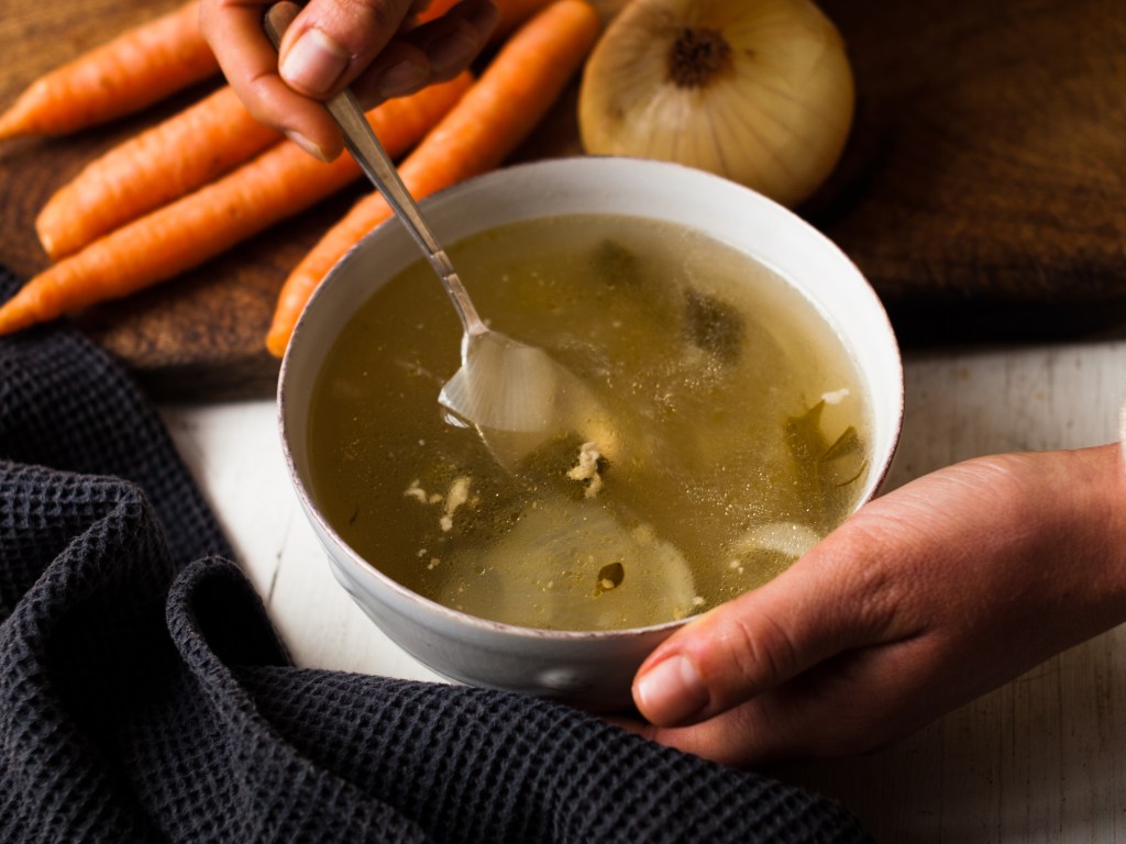 Person drinking bone broth