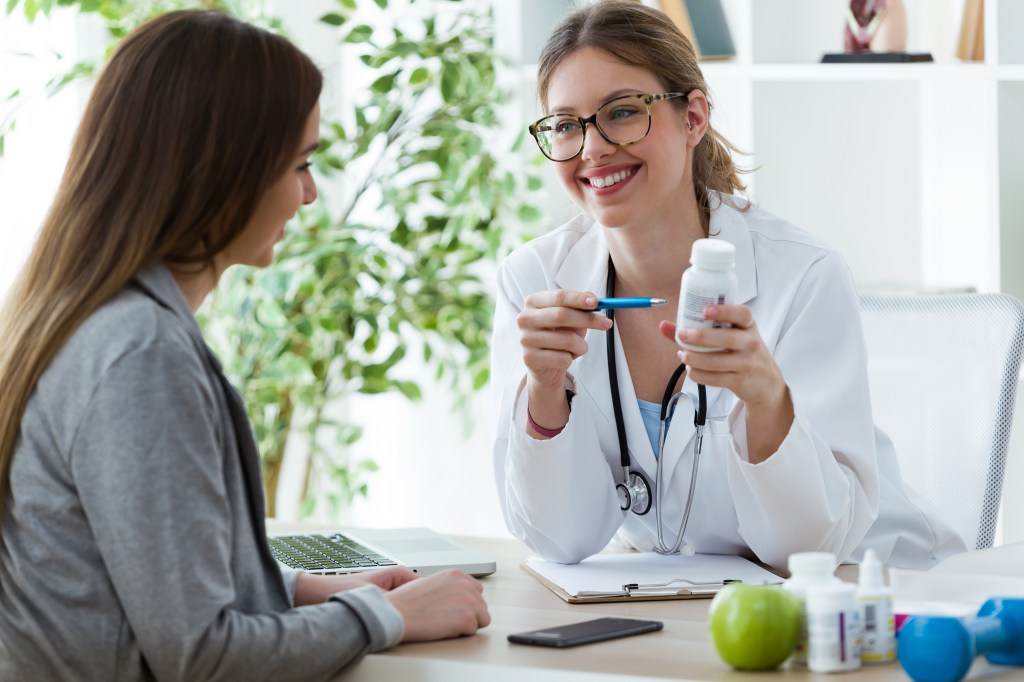 Woman talking to her doctor about supplements