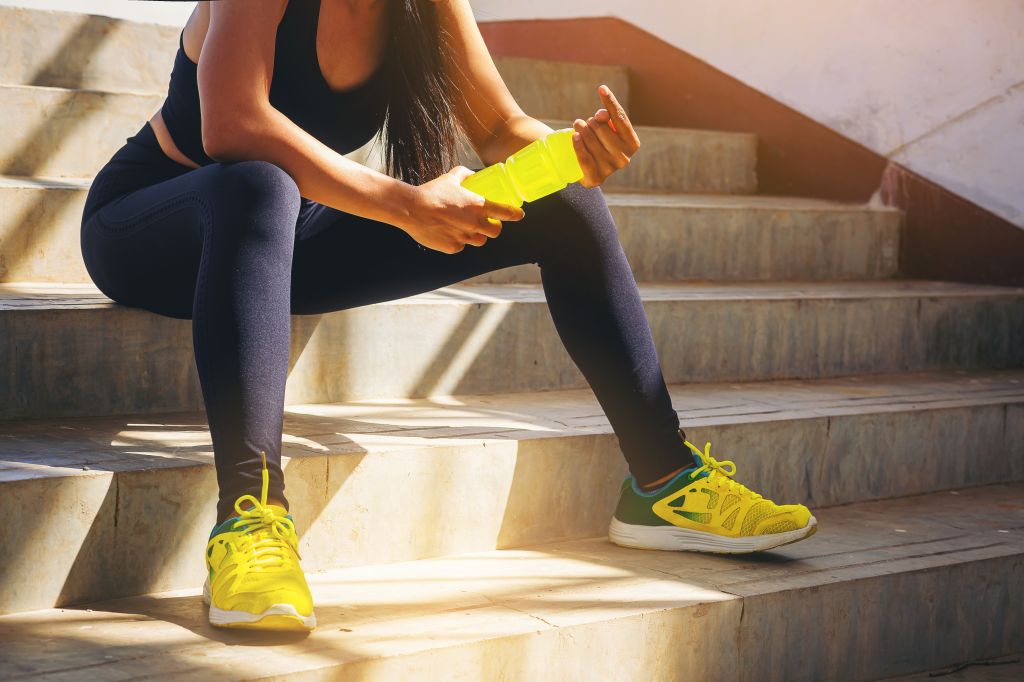 Athletic women with electrolyte drink