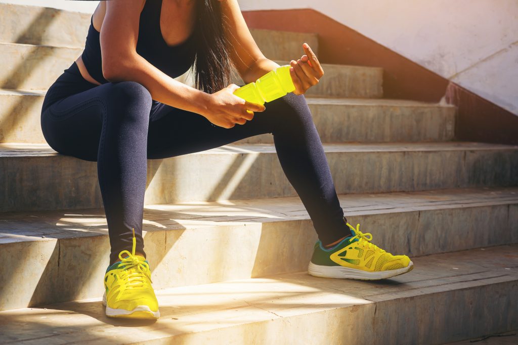 Athletic women with electrolyte drink